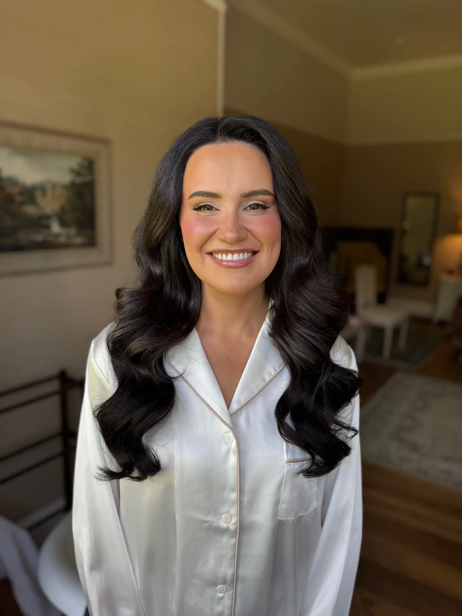 Brunette client with long, voluminous glossy waves